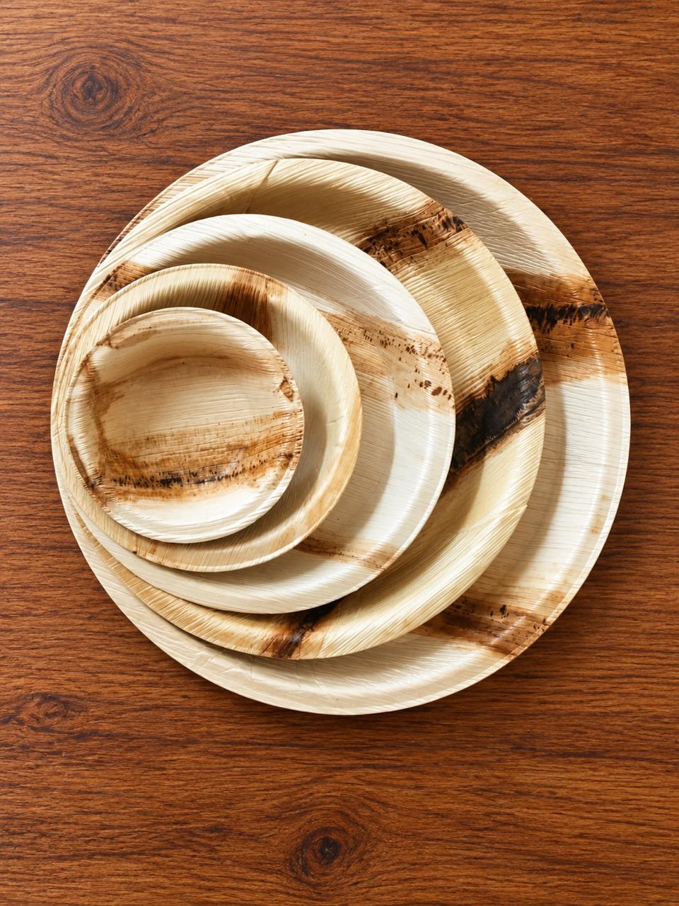 Nested areca leaf plates of different sizes